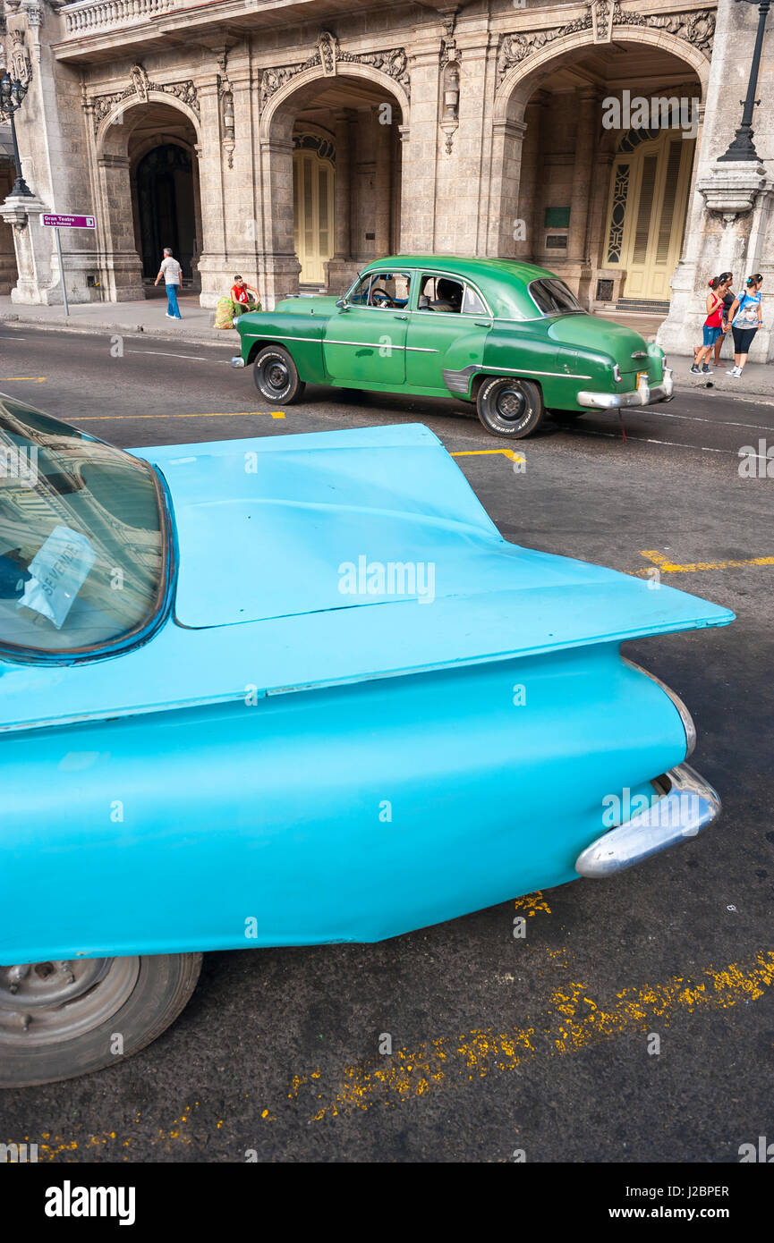 HAVANA - JUNE, 2011: Colorful forms of vintage American cars from the 1950s serve as share taxis on the streets of Centro. Stock Photo