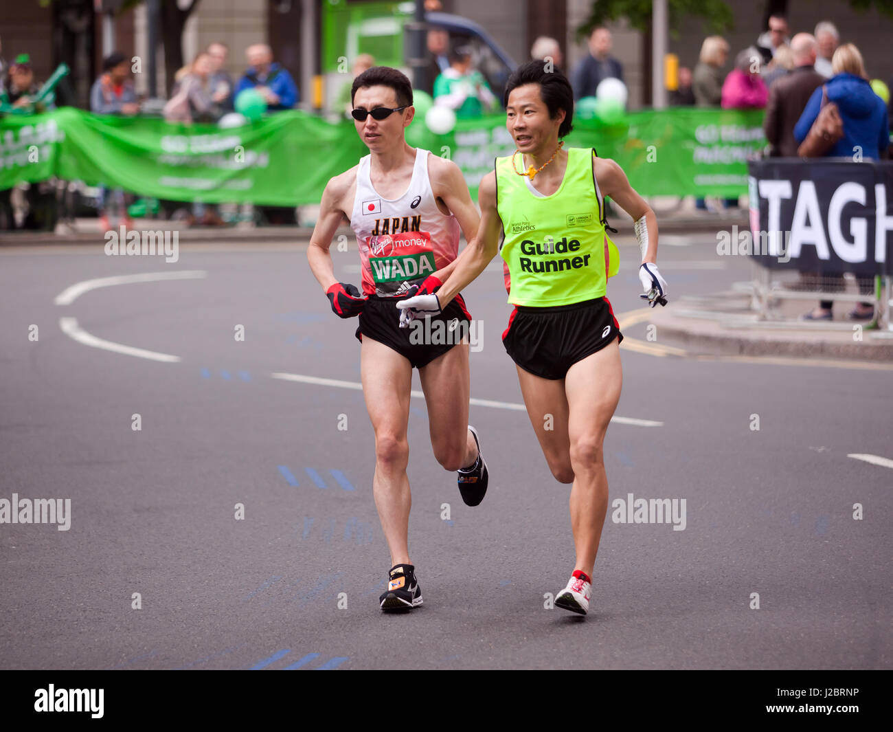 Shinya Wada, from Japan, with his guide runner competing in the 2017 London marathon. He went on to finish  5th in the World Para Athletic World Cup Stock Photo