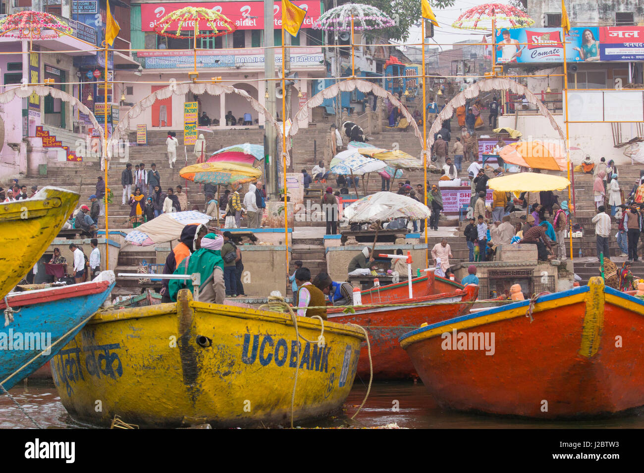 India, Uttar Pradesh, Varanasi. Small boats tied up at the Ganges River ...