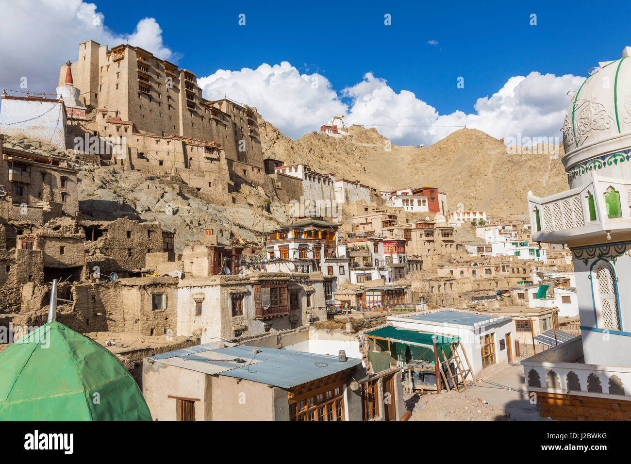 Leh Palace above main town with Tsemo Gompa on ridge behind Leh Ladakh Stock Photo