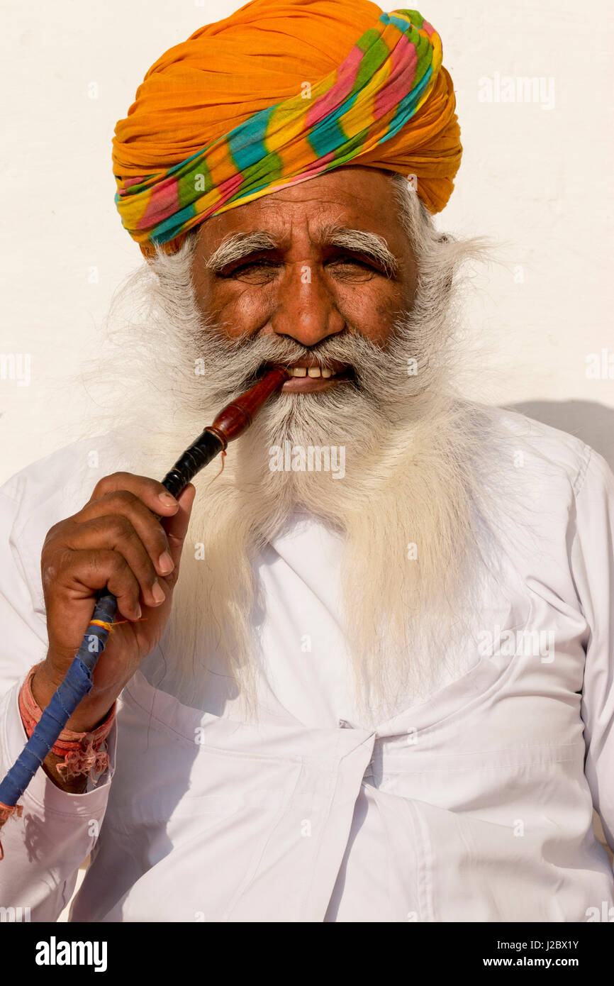 Portrait of man smoking pipe. Mehrangarh Fort. Jodhpur. Rajasthan. India. Stock Photo