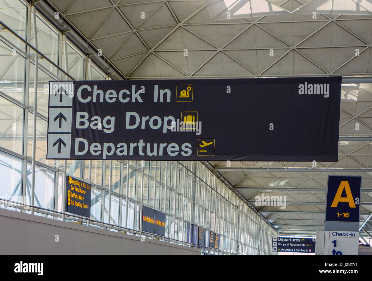 Check In, Bag Drop, Departures sign, London Stansted Airport Stock
