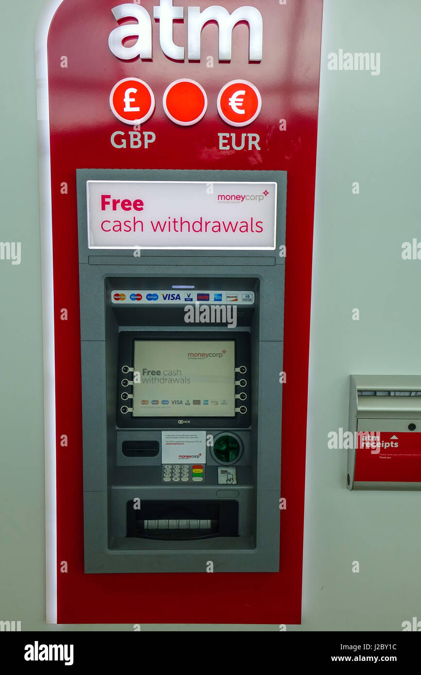 Red ATM cash machine, London Stansted Airport Stock Photo