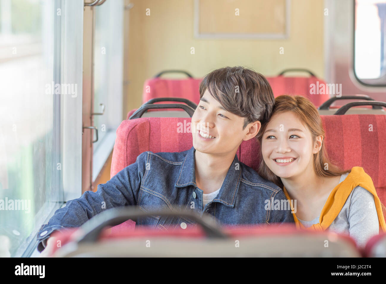 Portrait of young smiling couple travelers Stock Photo