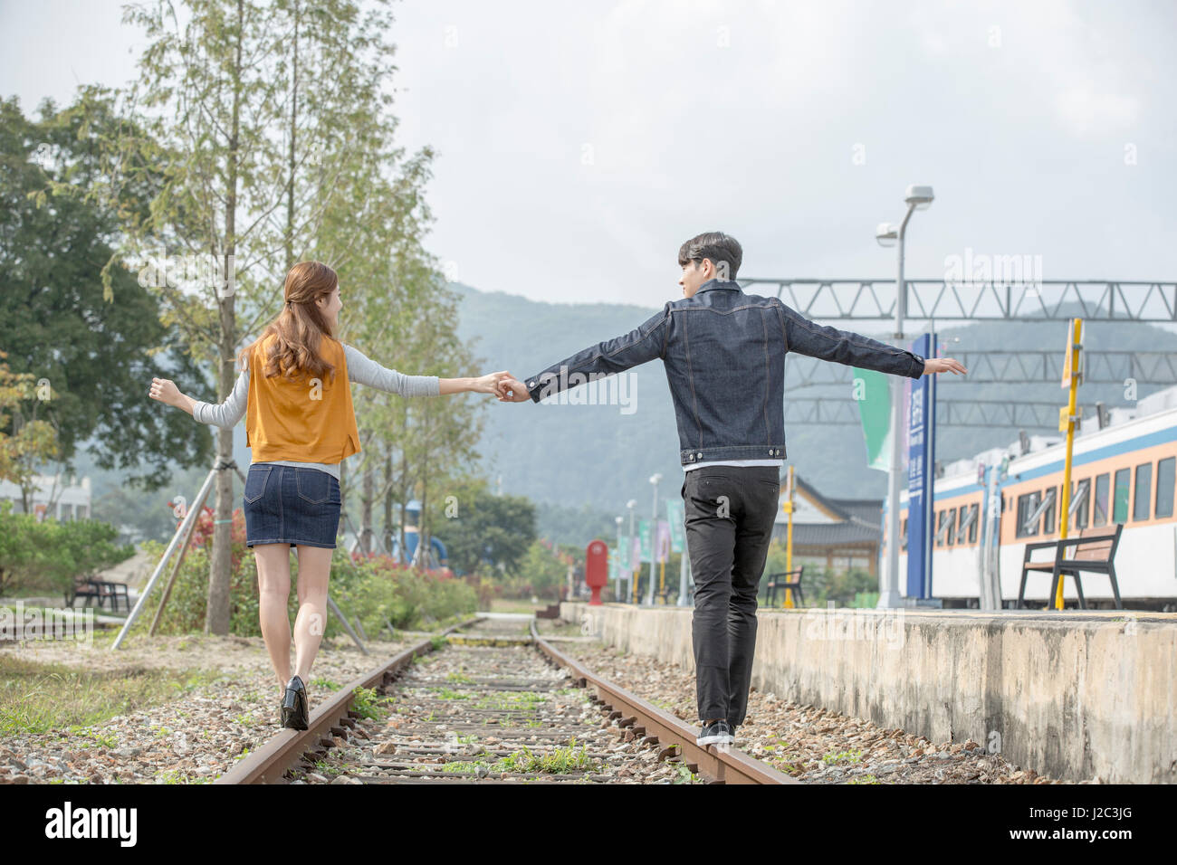 Young couple walking on railway hi-res stock photography and images - Alamy