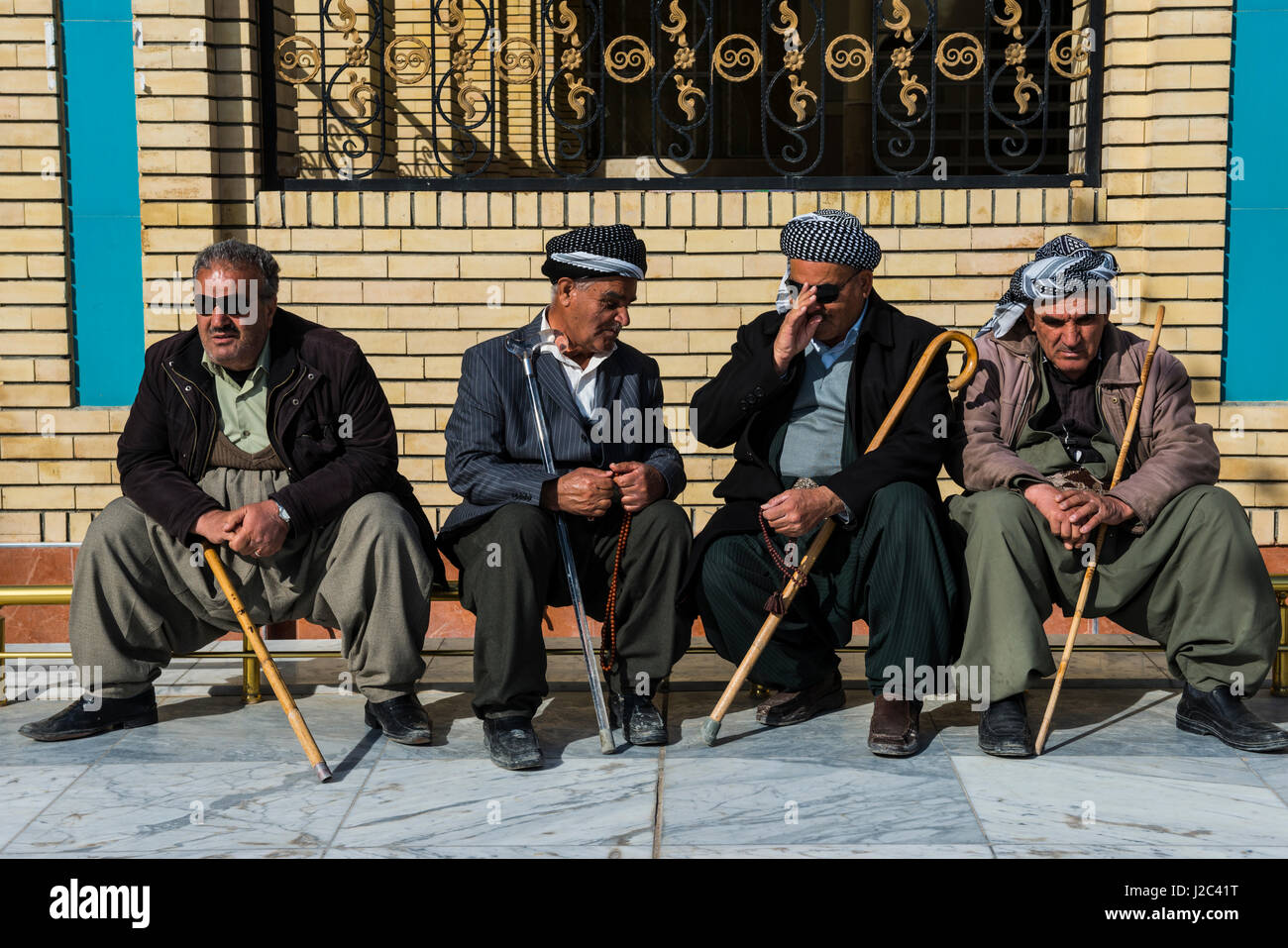 Old men having their morning chat in the Grand Mosque in the Bazaar of Sulaymaniyah, Iraq, Kurdistan (Large format sizes available) Stock Photo