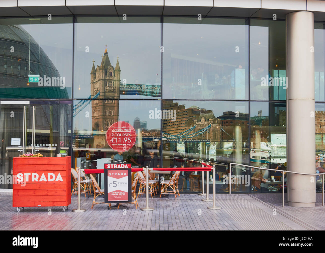 Tower Bridge reflection in Strada restaurant window, South Bank, London, England Stock Photo