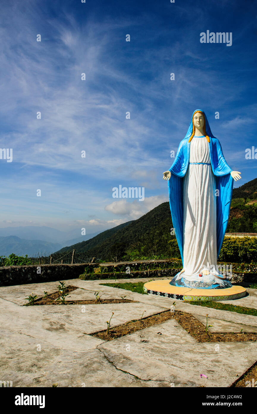 Maria statue on top of a pass, along the rice terraces from Bontoc to Banaue, Luzon, Philippines Stock Photo