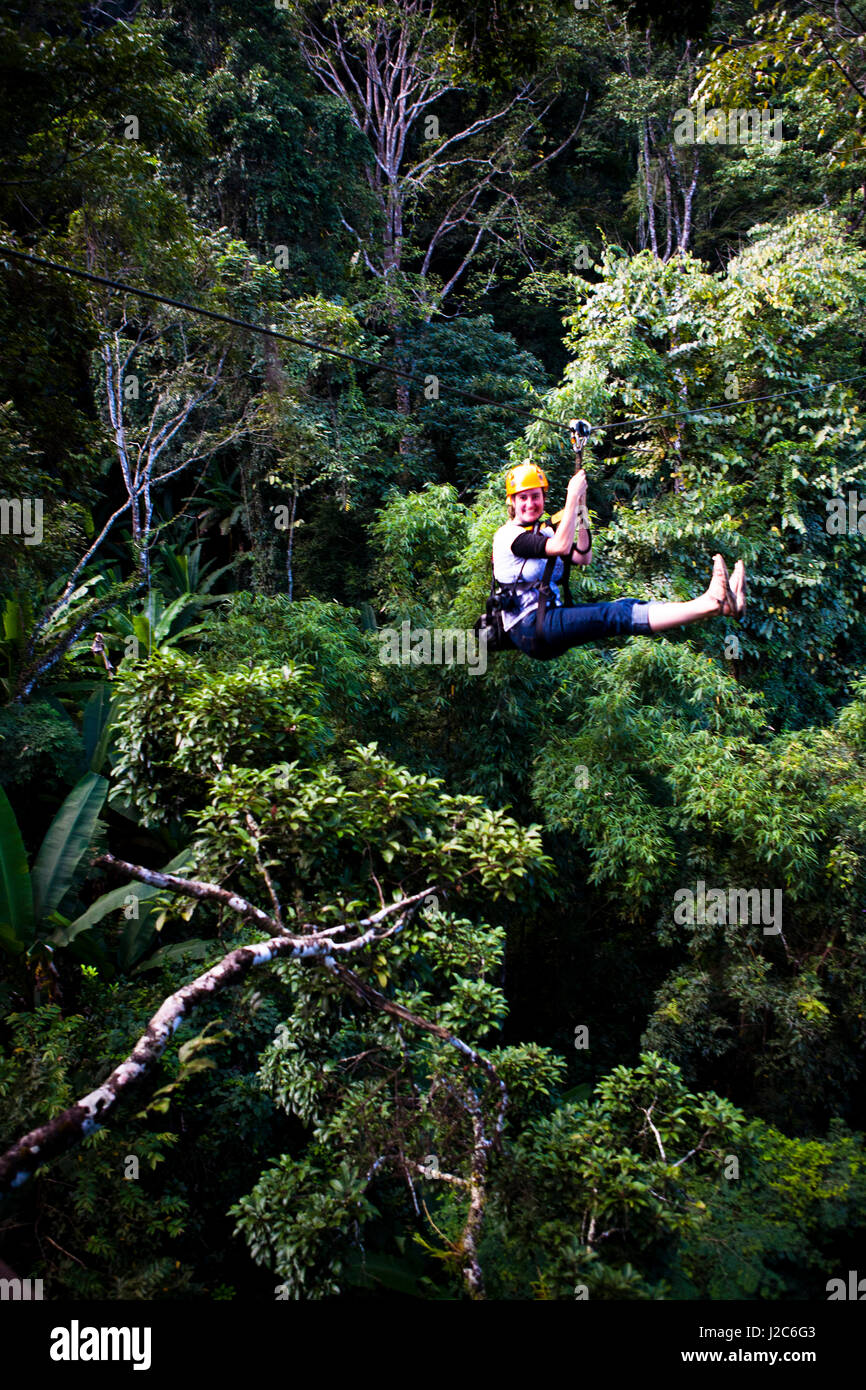 Zip-lining is one of the most popular tours in Thailand. Zip-lines take you on an unparalleled journey through the forests surrounding Chang Mai. Stock Photo