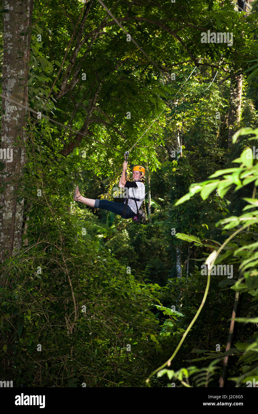 Zip-lining is one of the most popular tours in Thailand. Zip-lines take you on an unparalleled journey through the forests surrounding Chang Mai. Stock Photo