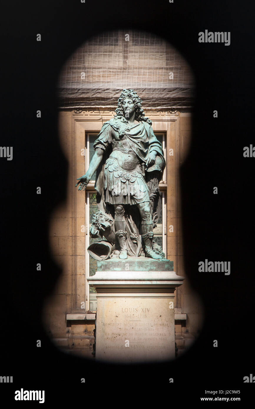 View through an old key hole of Louis XIV statue inside Musee Carnivalet (History of France Museum) in the Marais, Paris, Ile-de-France, France Stock Photo