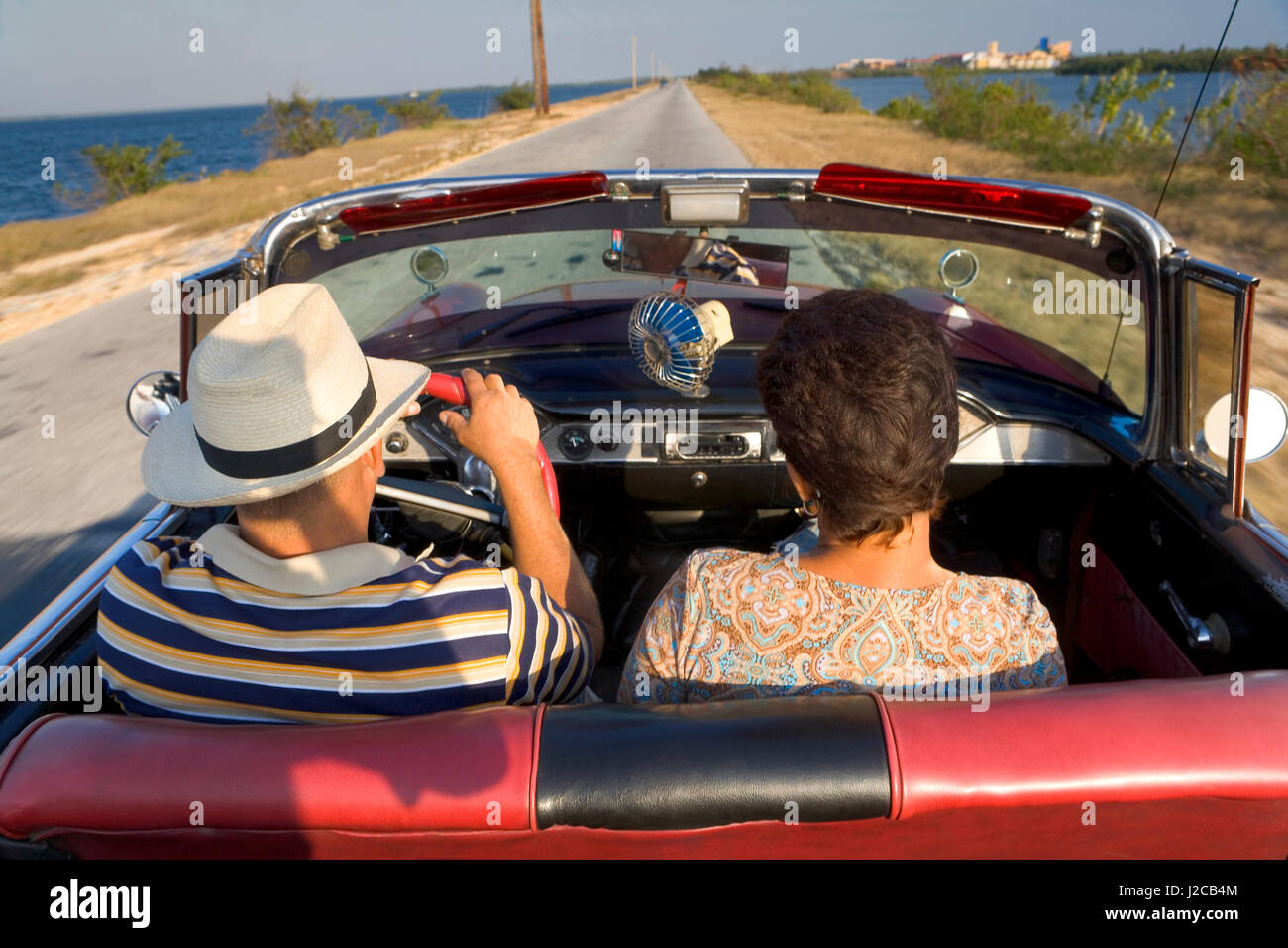 Couple enjoying a nice ride in their classic American Convertible