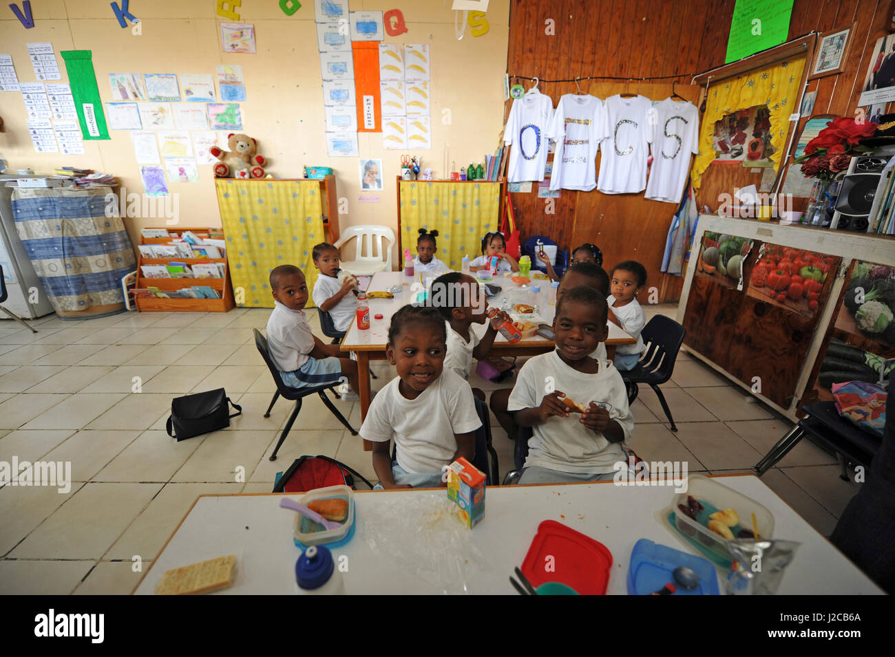 Dominica, Roseau, Preschool CCF, children having lunch in classroom