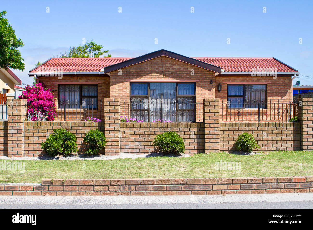 South Africa, Western Cape, Cape, Beautiful house behind a fence in