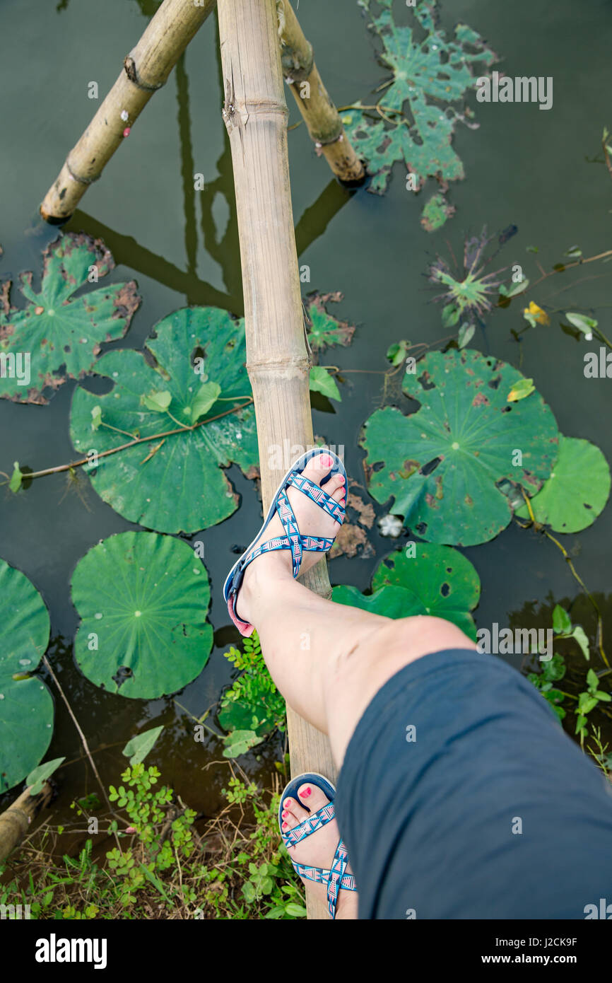 Cồn Sơn, Bùi Hữu Nghĩa near Cần Thơ, capital and largest city in the Mekong DeltaRunning on a land monkey bridge. Stock Photo