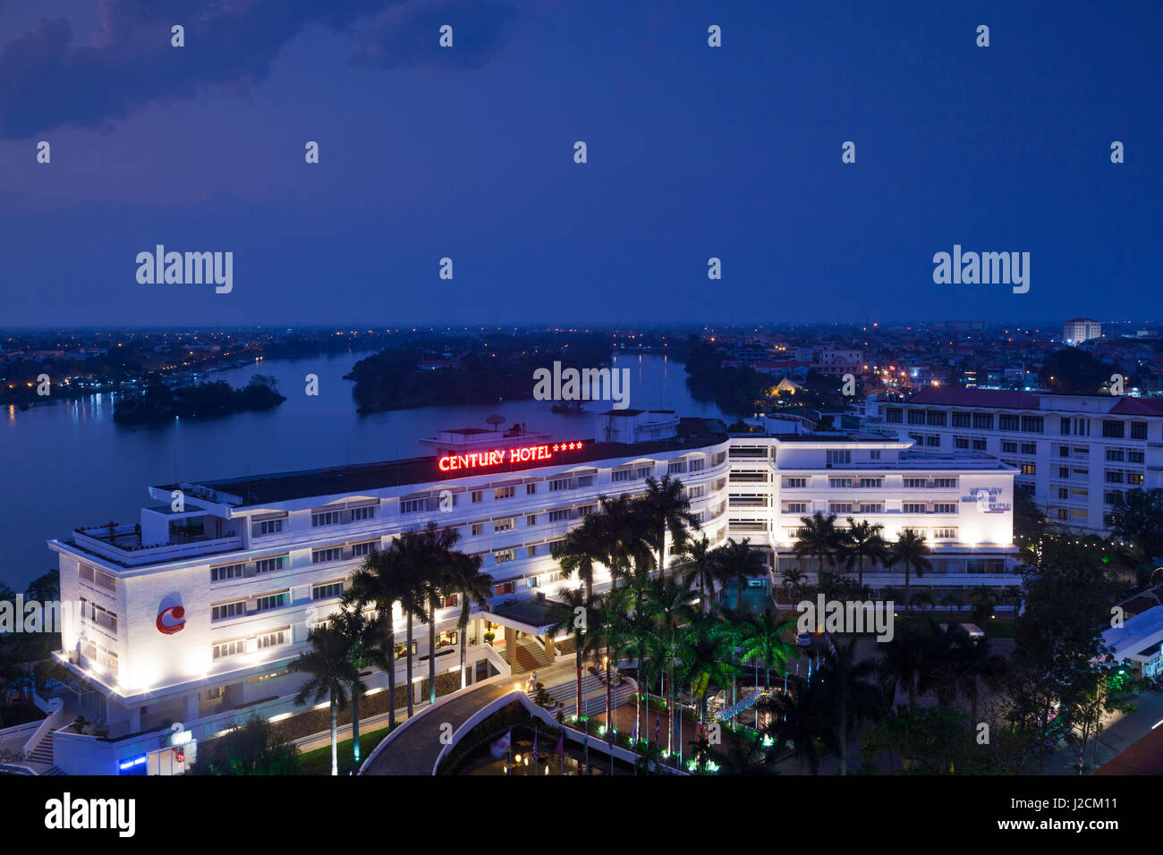 Vietnam, Hue. Elevated view of Century Hotel and Perfume River, dusk Stock Photo