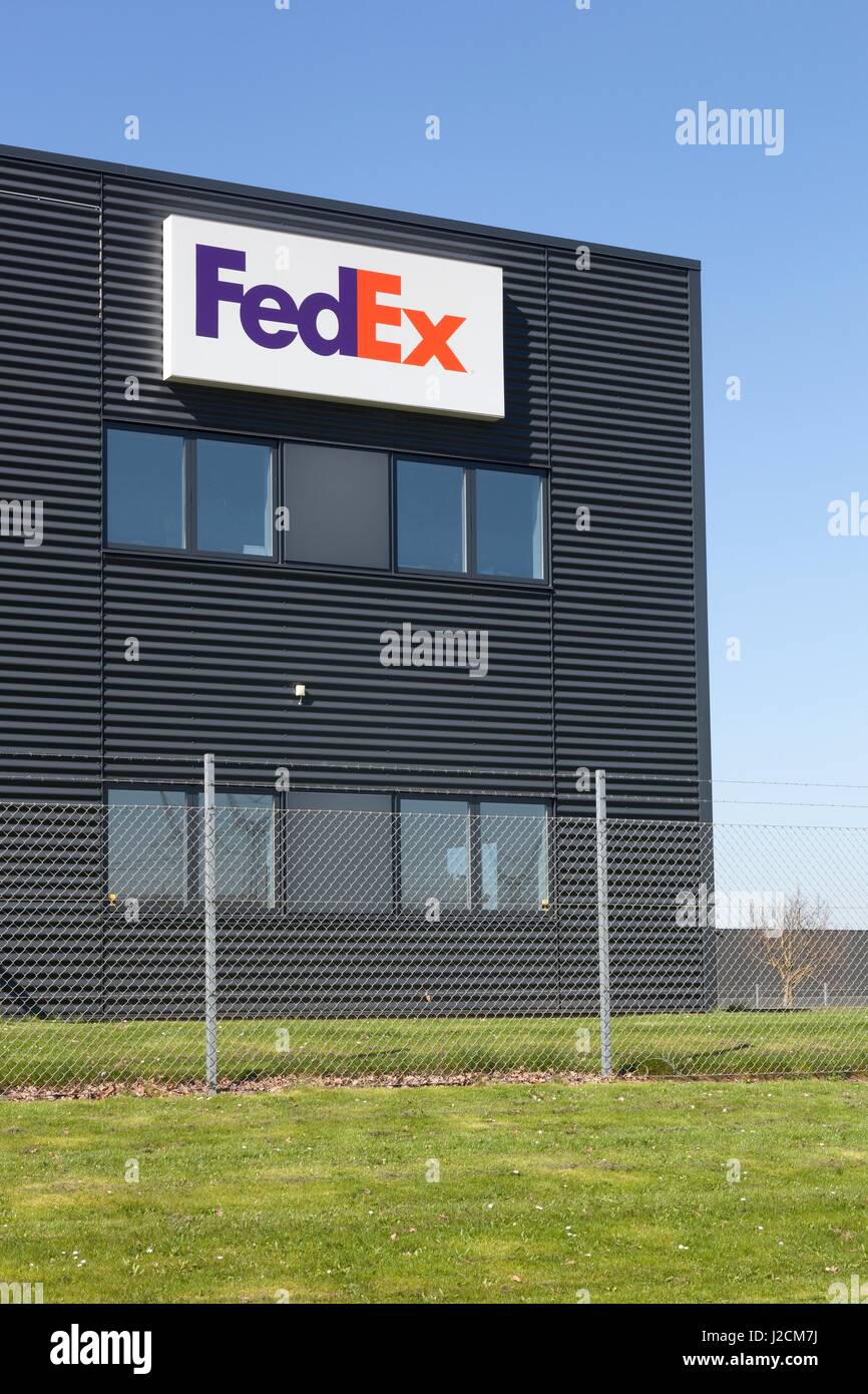 Odense, Denmark - April 9, 2017: FedEx building and warehouse. FedEx Corporation is an American global courier delivery services company Stock Photo