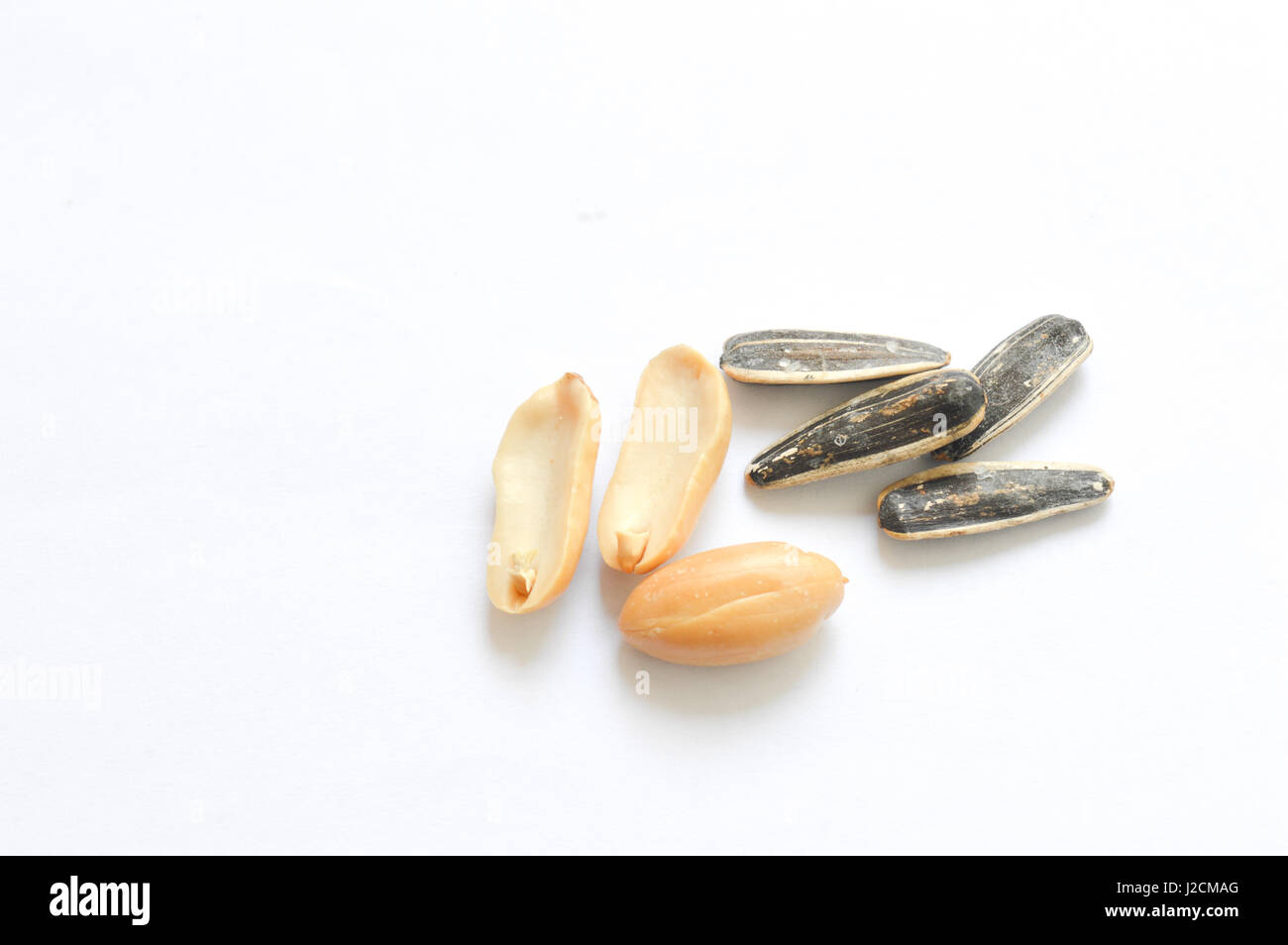 peanuts and sunflower seeds isolated on white Stock Photo Alamy