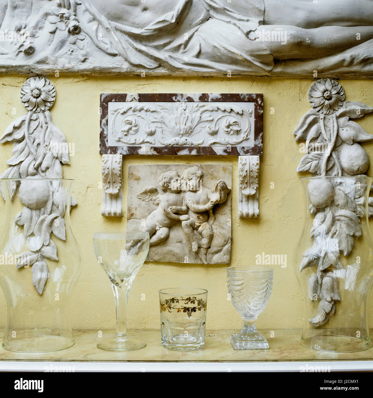 Glassware below sculpture. Stock Photo