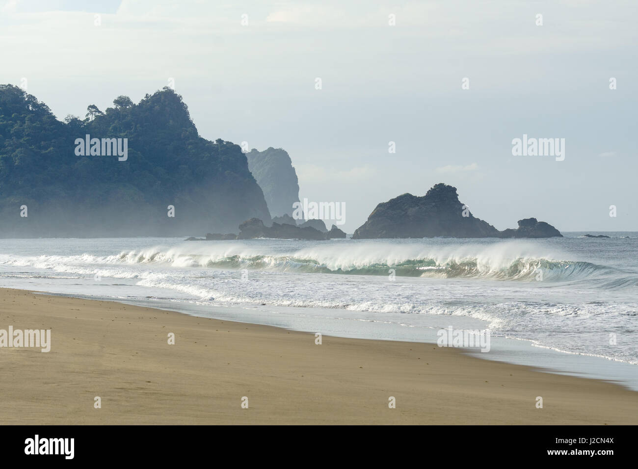 Indonesia, Java Timur, Kabany Banyuwangi, Meru Betiri National Park, waves on the lonely beach Stock Photo
