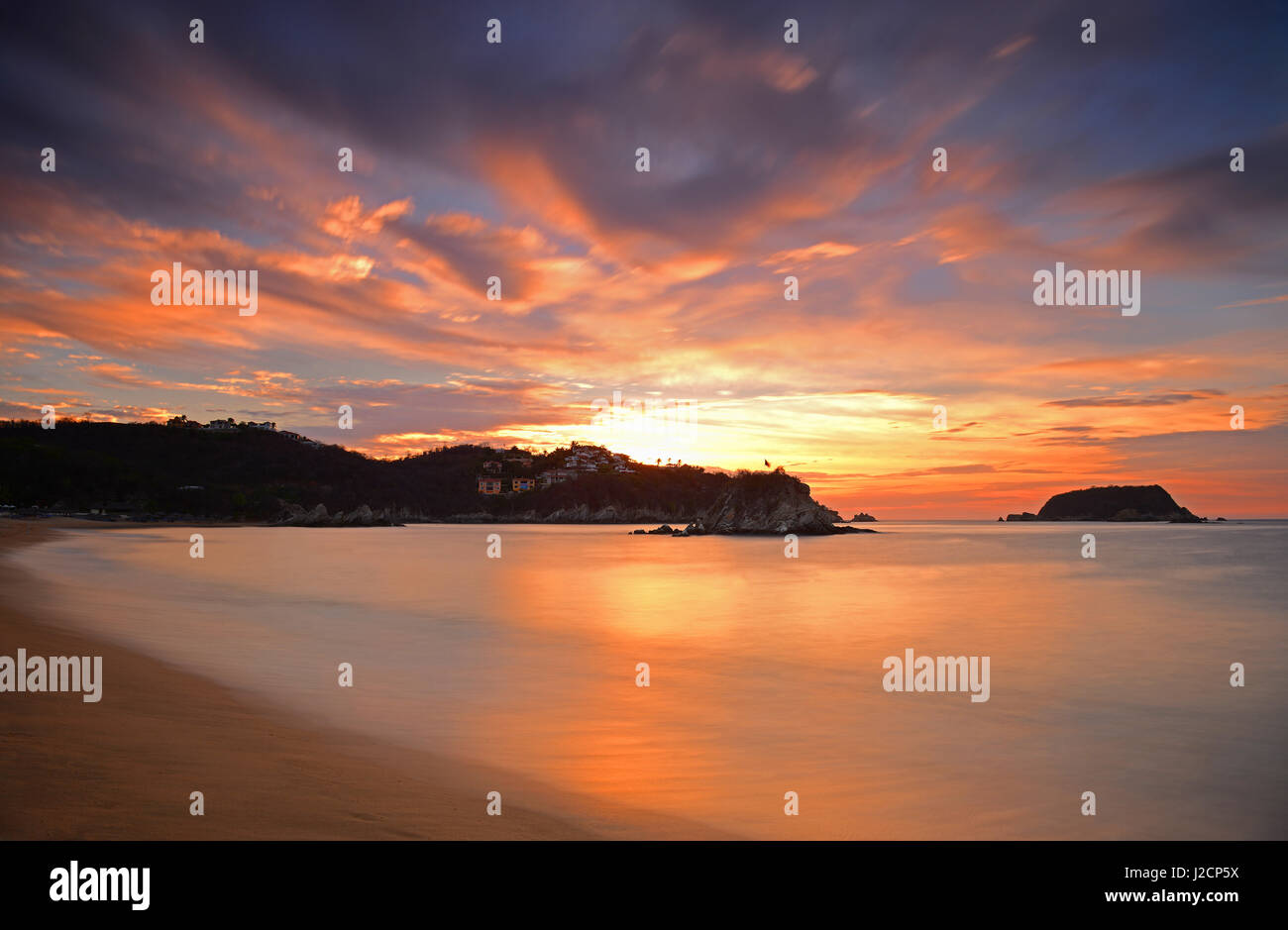 Sunrise at Tangolunda bay in the famous beach resort of Huatulco, Mexico. Stock Photo