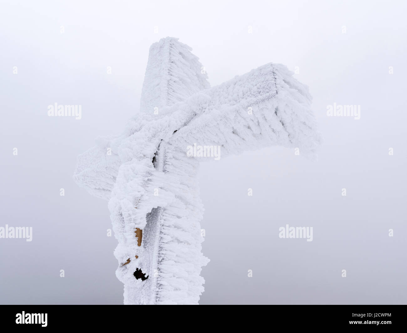 Summit Cross in the National Park Bavarian Forest (Bayerischer Wald) in the deep of winter on the top of Mount Lusen, Bavaria, Germany. (Large format sizes available) Stock Photo