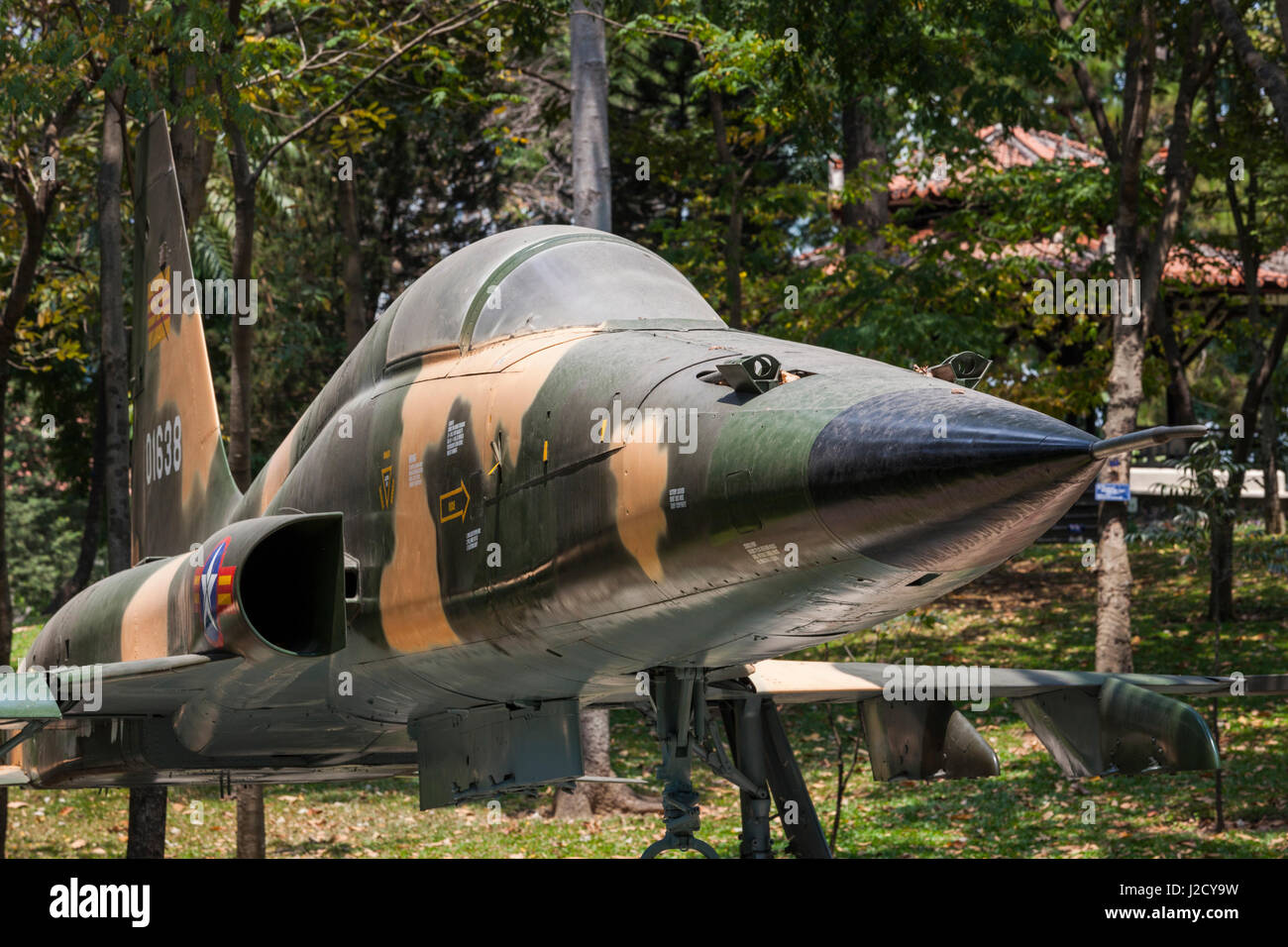 Vietnam, Ho Chi Minh City. Reunification Palace, former seat of South Vietnamese Government, Former South Vietnamese F-5E fighter plane used to bomb the palace at the end of the Vietnam War Stock Photo