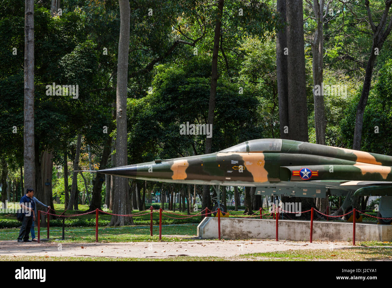 Vietnam, Ho Chi Minh City. Reunification Palace, former seat of South Vietnamese Government, Former South Vietnamese F-5E fighter plane used to bomb the palace at the end of the Vietnam War Stock Photo