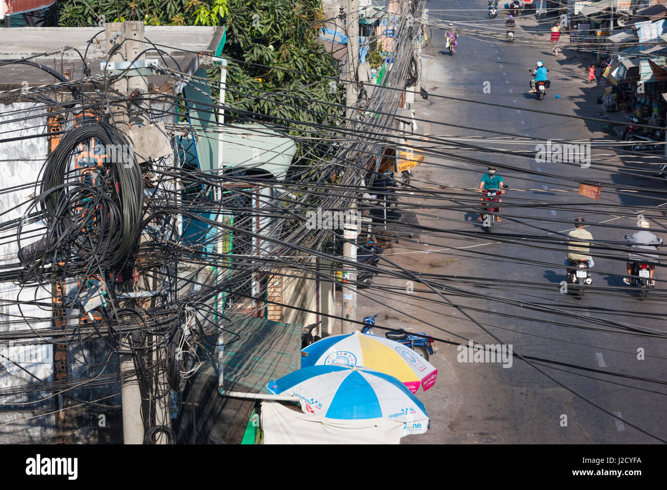 Vietnam, Mekong Delta. Can Tho, electrical wires over street Stock