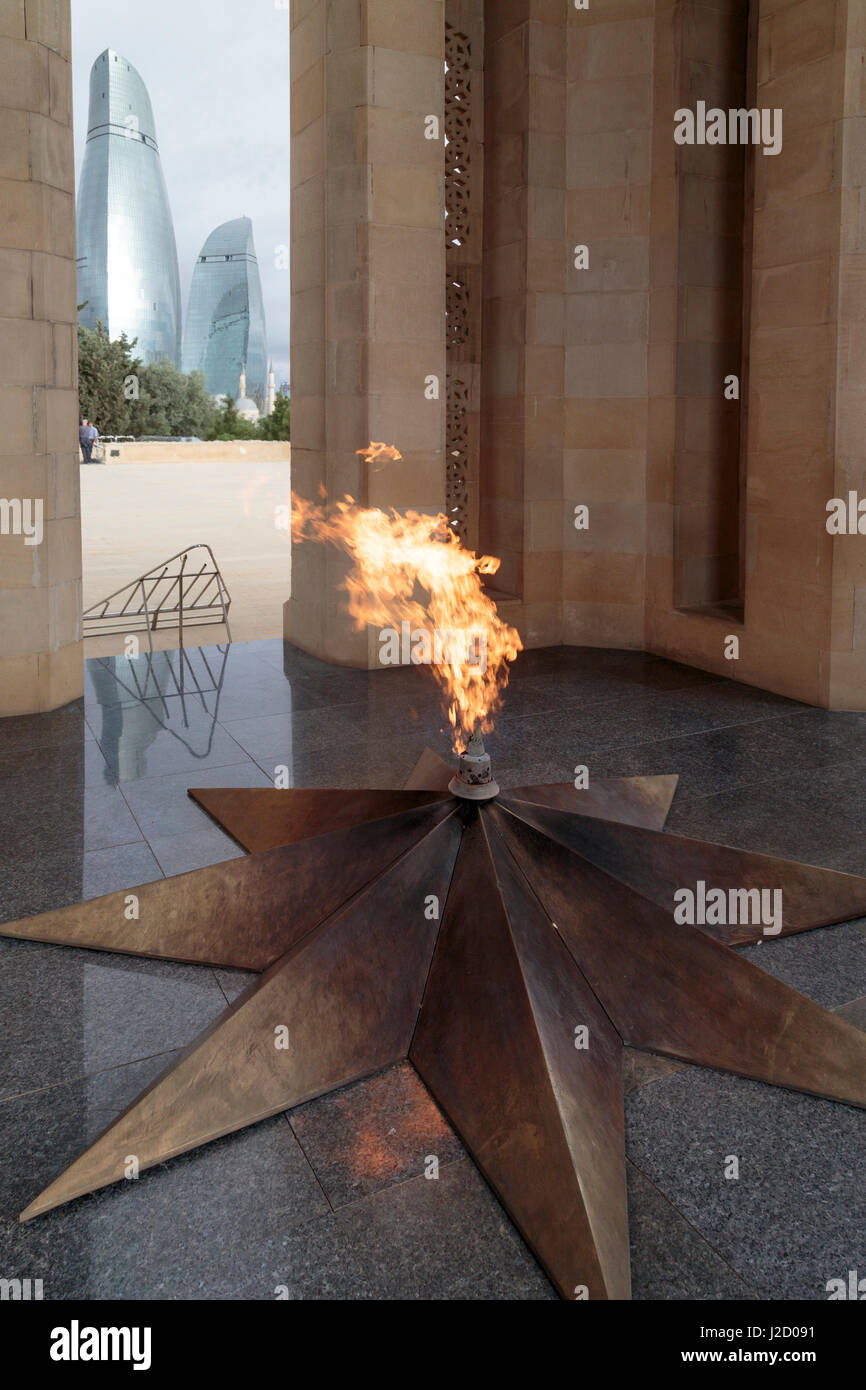 Azerbaijan, Baku. The Eternal Flame memorial in Dagustu park, with the Flame  Towers in the distance Stock Photo - Alamy