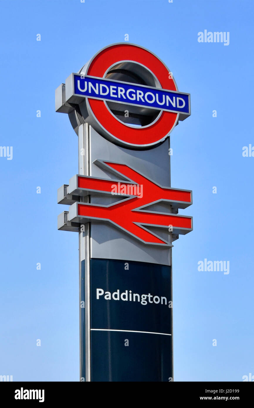 Paddington train station sign & iconic London Underground roundel sign above original British Rail logo now a generic symbol for railway stations Stock Photo