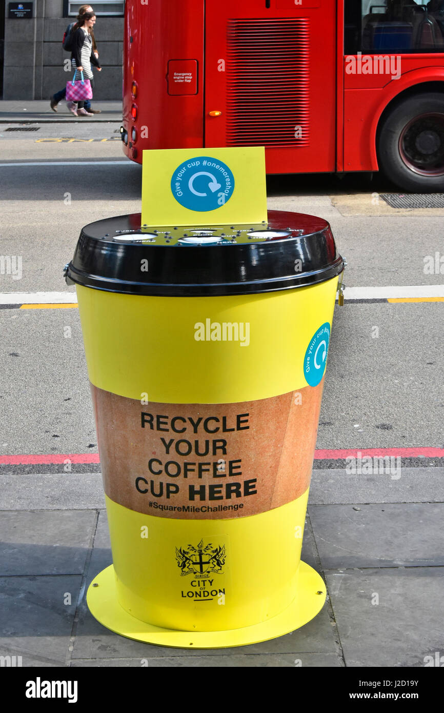 City of London England UK a special bin to recycle paper coffee cups into yellow bins on pavement have been placed around the London Square Mile Stock Photo