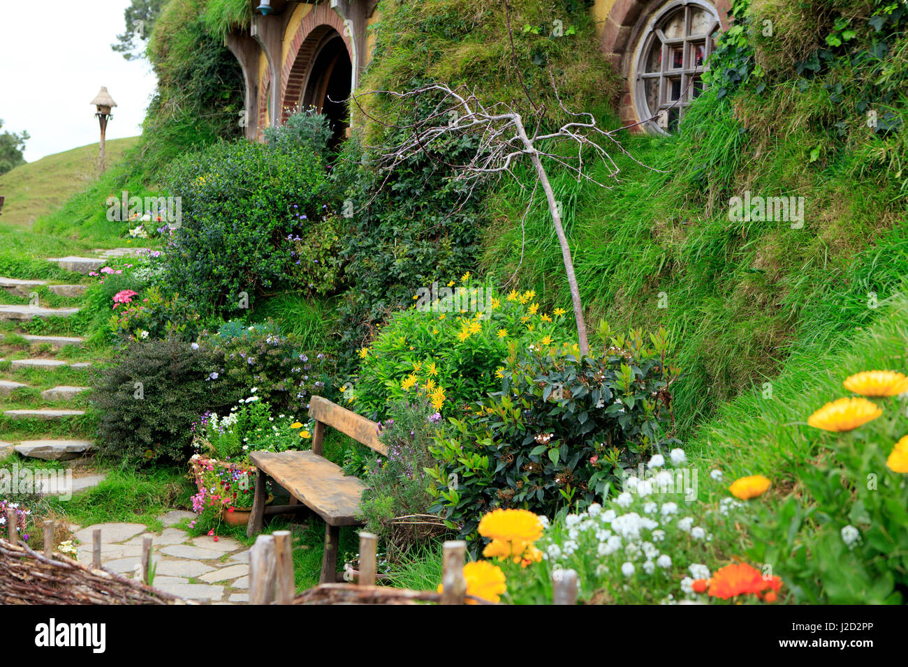 Hobbiton, near Matamata on the north island of New Zealand, is the movie set used in the movie series 'Lord of the Rings' and 'The Hobbit'. This particular house is known as Bag End and is the home of the movie's protagonist-Bilbo Baggins. Stock Photo