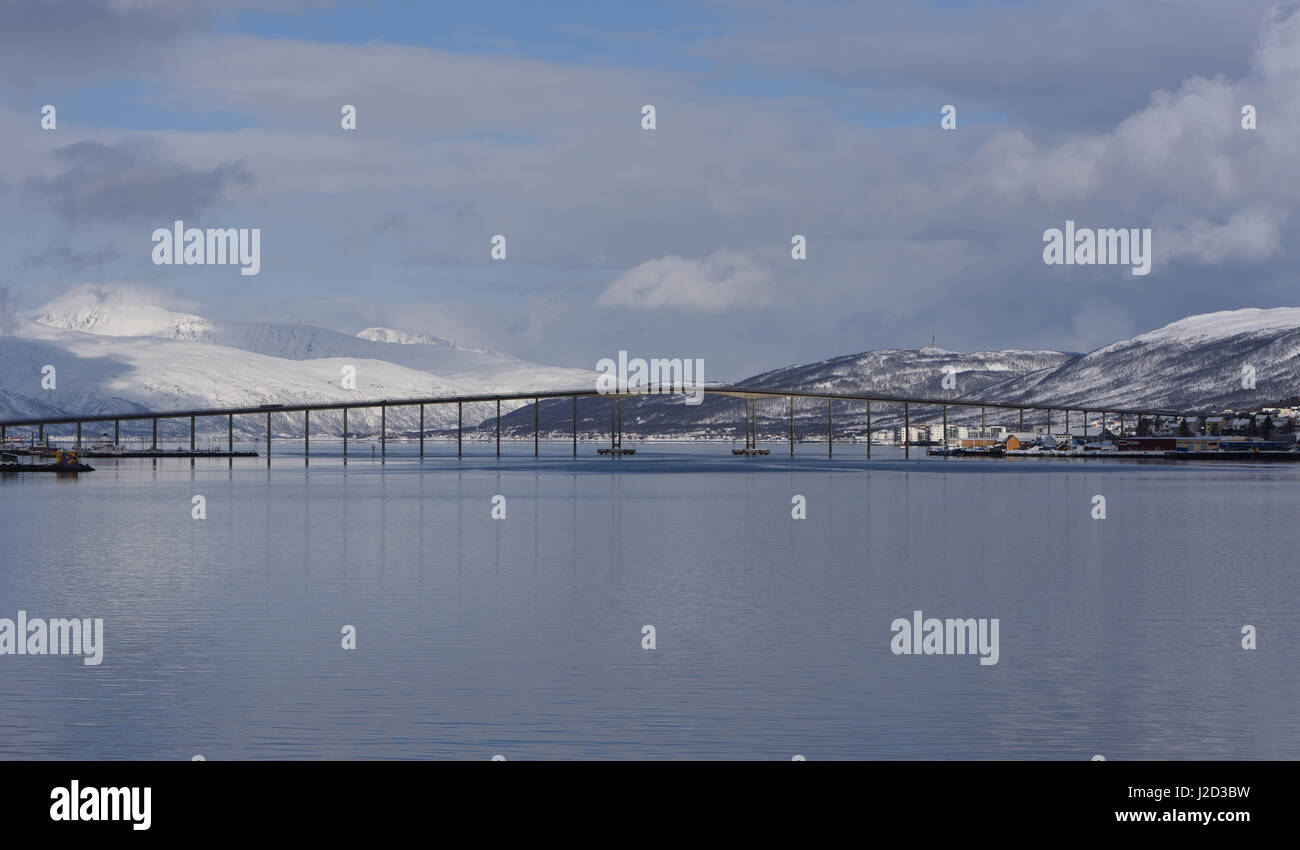 The Tromsø Bridge, Tromsøbrua, crosses the Tromsøysundet strait between Tromsdalen on the mainland and the island of Tromsøya. Bruvegen, Tromsø, Troms Stock Photo
