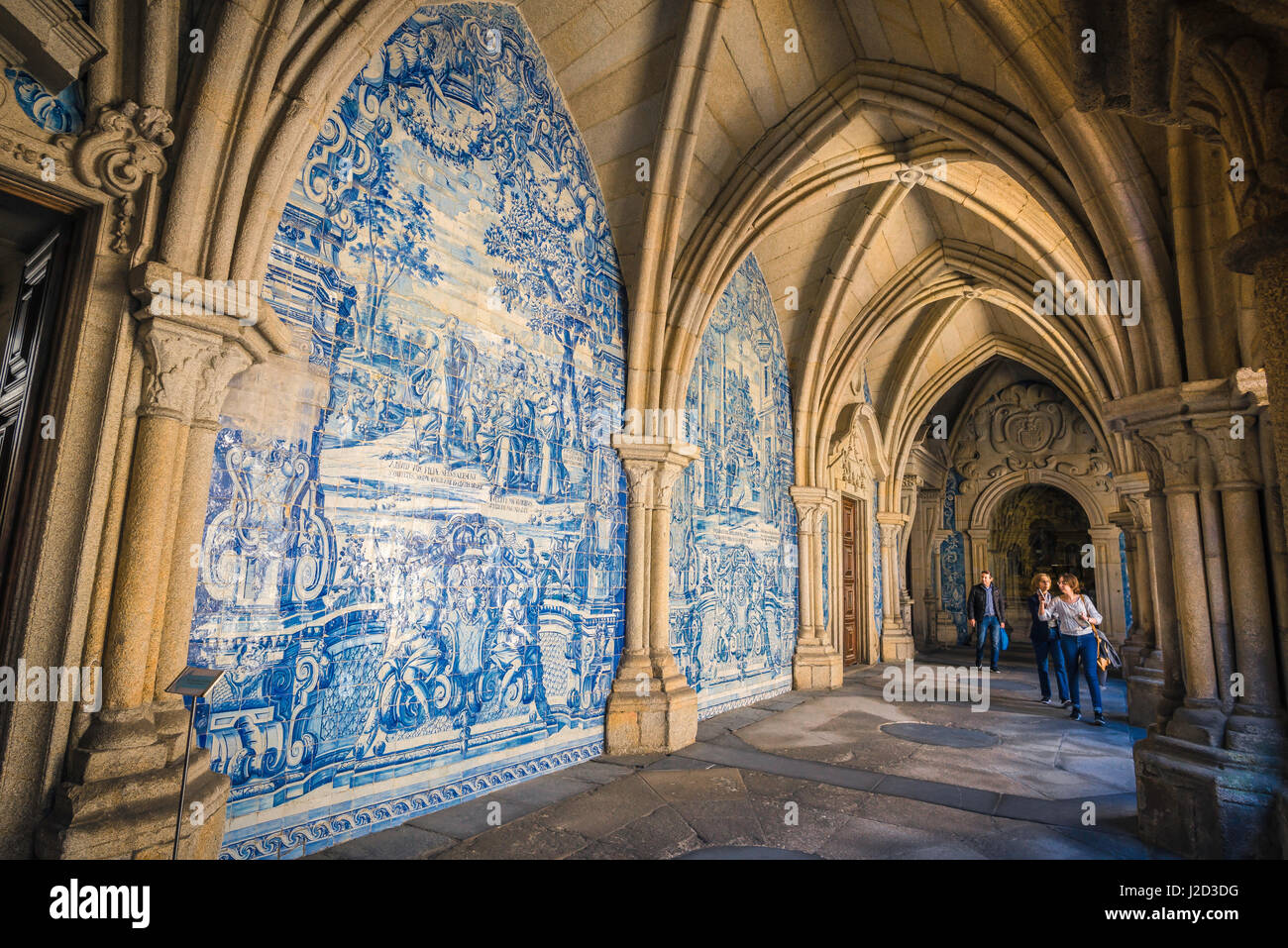 porto-portugal-azulejos-tourists-look-at-a-section-of-wall-in-the