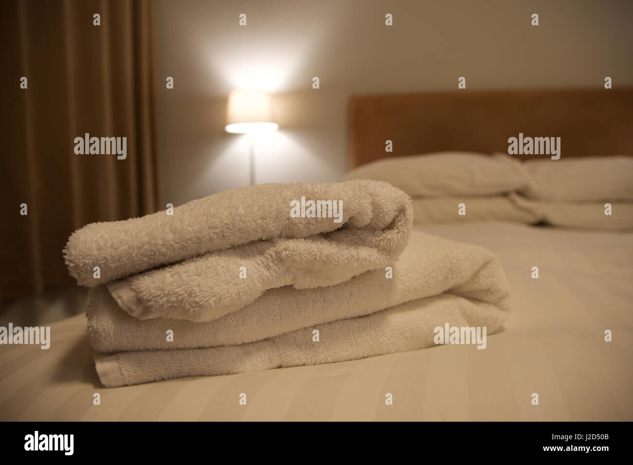 Towels on bed Stock Photo Alamy