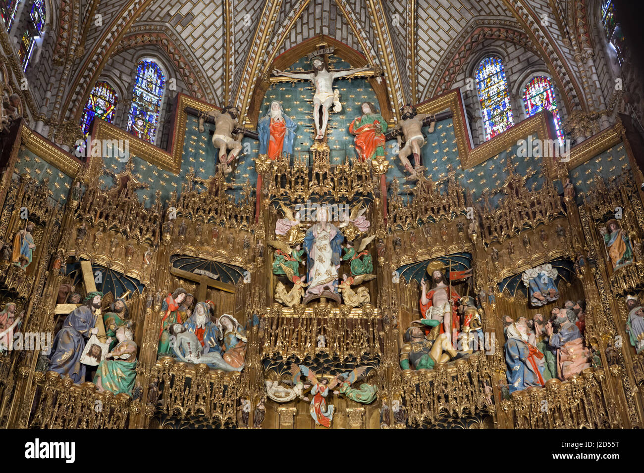 Gothic retablo in the Capilla Mayor (main chapel) in the Toledo Cathedral in Toledo, Spain. Late Gothic wooden retablo (retable altarpiece) was carved from 1497 to 1504 by Spanish sculptor Enrique Egas and Pedro de Gumiel among the others. Stock Photo