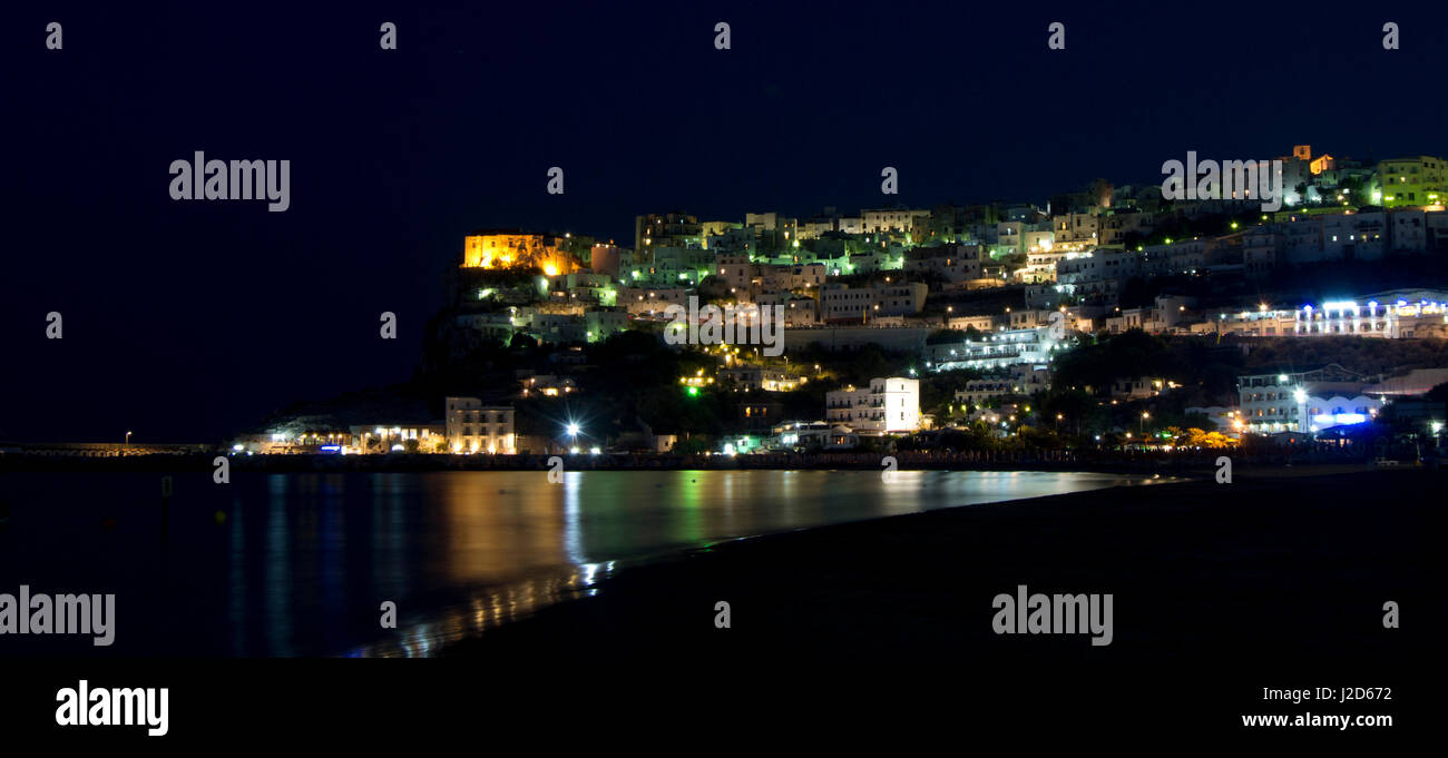 Peschici promontory at night with lights reflections on the sea Stock Photo