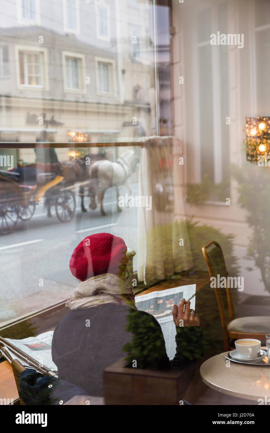Woman sitting in a cafe, Salzburg, Austria Stock Photo