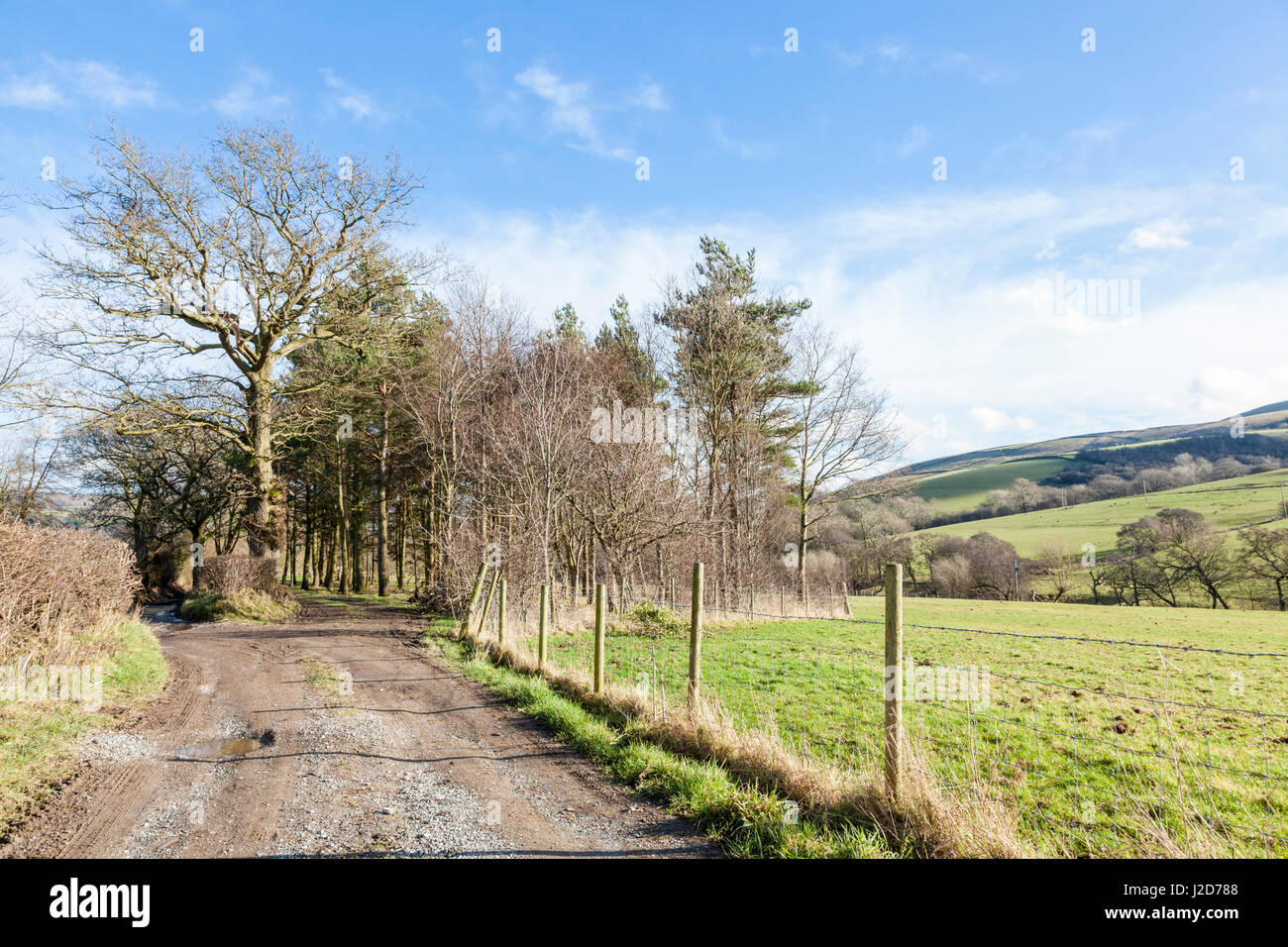 Rough farm track through countryside, Shatton, Derbyshire, England, UK Stock Photo