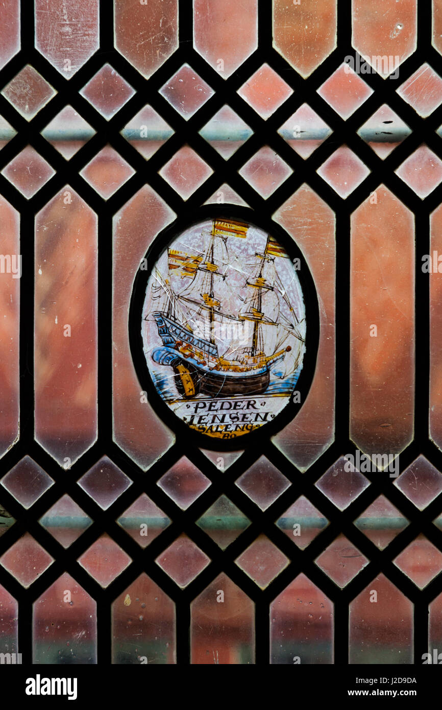 Denmark, Jutland, Aarhus, Den Gamle By, reconstructed Old Town, stained glass window with sailing ship Stock Photo