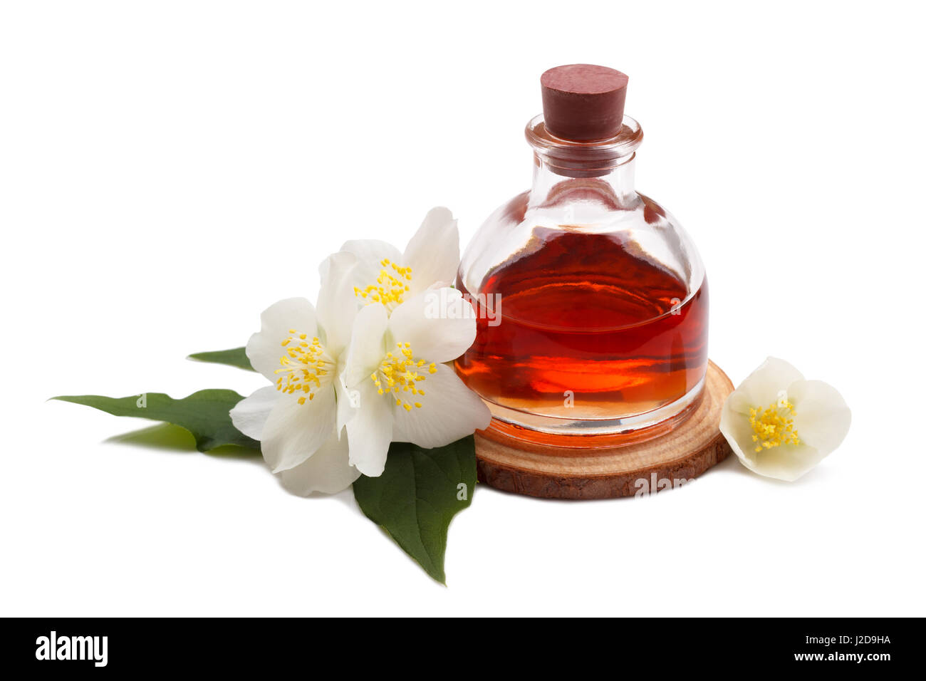 Essential oil with jasmine flower isolated over white Stock Photo