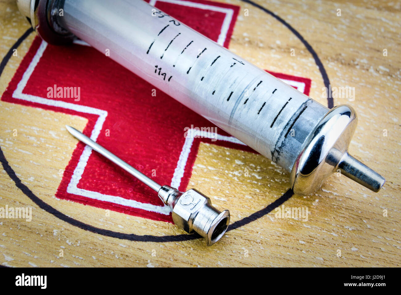 Vintage syringe and needle on a first aid kit, concept of sanitary equipment Stock Photo Alamy