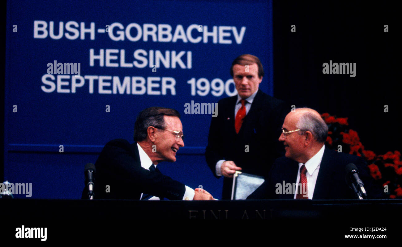George H.W. Bush and Mikhail Sergeyevich Gorbachev shake hands at a press conference at the Helsinki summit on September 10, 1990 Stock Photo