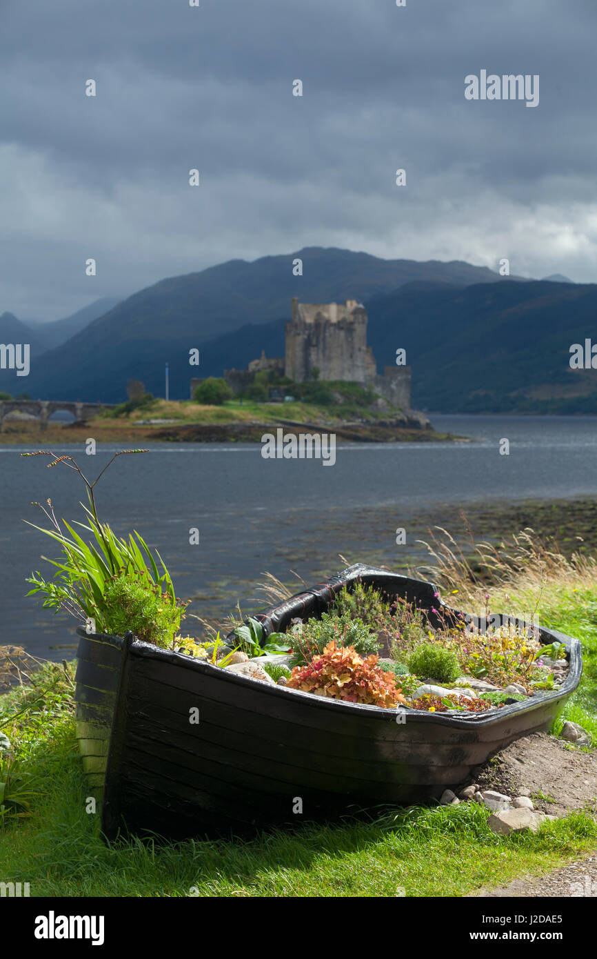 The 13th century castle Eilean Donan Castle is located in Loch Duich. A stone arch bridge connects the island to the mainland Stock Photo