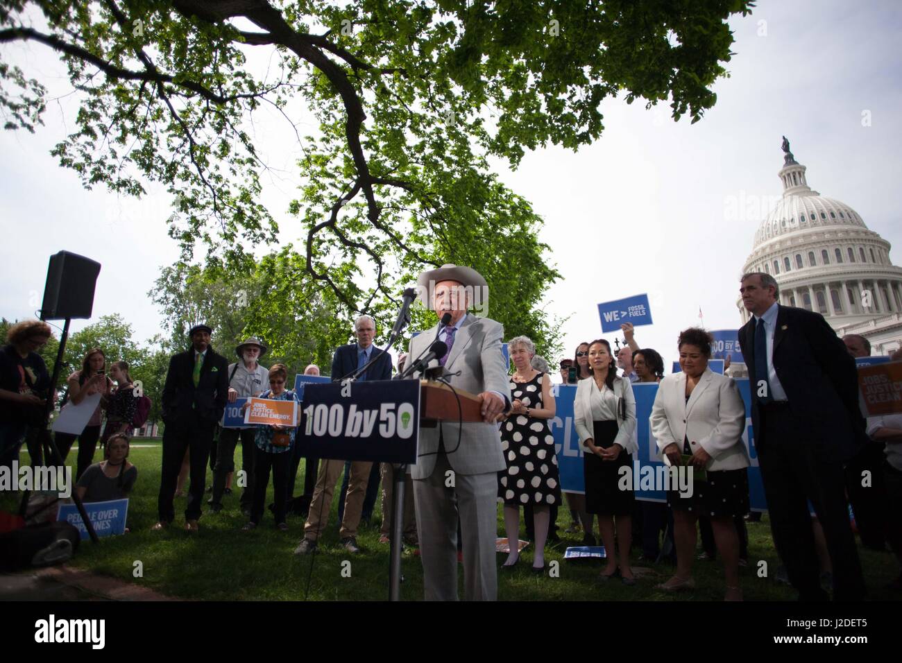 April 27, 2017 - Washington Dc, District of Colombia, United States - WASHINGTON DC. APRIL 27th 2017, Senators Jeff Merkley speaking infront of the capitol hill building in Washington DC, backed with a group of liberal senators and state representatives in addition to a number of environment activists and supporters, Merkley introduced ''100 by 50 Act'' legislation that is expected to completely phase out fossil fuel use by 2050. Senator Markley explained that this bill's plan is to support workers and to prioritize low-income communities while replacing oil, coal and gas with clean energy sou Stock Photo