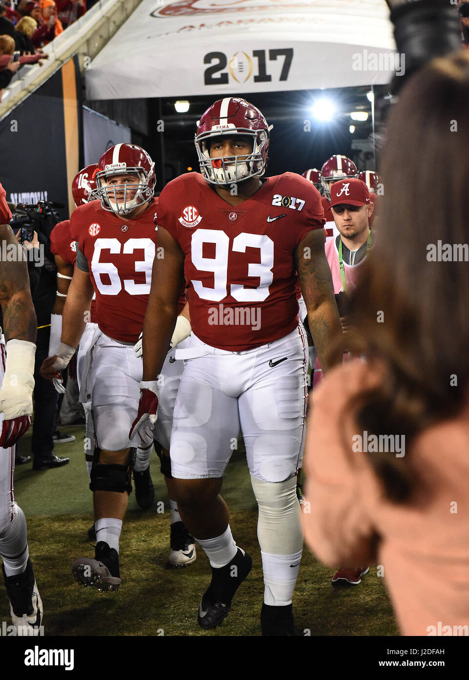 January, 9 2017 Tampa, FL.Alabama Crimson Tide defensive lineman (93) Jonathan Allen, and Offensive Lineman (63) J.C. Hassenauer enter the field during pre-game ceremonies during the National Championship college football game between the Clemson Tigers, and Alabama Crimson Tide, on January 9, 2017. The Clemson Tigers beat the Alabama Crimson Tide 35-31 at Raymond James Stadium for the National Title, in Tampa, FL. (Absolute Complete Photographer & Company Credit: Jose/MarinMedia.org/Cal Sport Media) (Network Television please contact your Sales Representative for Television usage.) (Tel Stock Photo