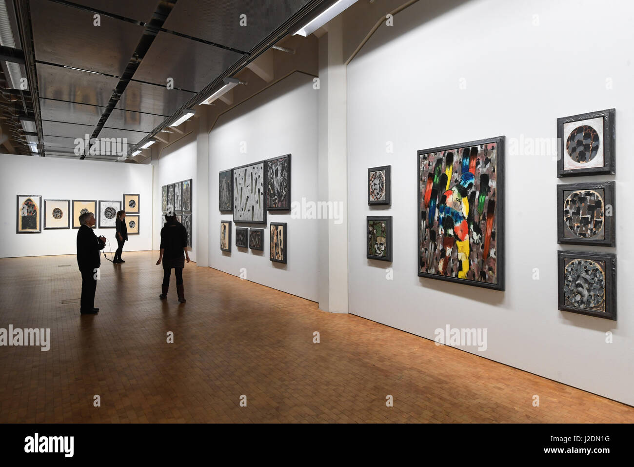 Karlsruhe, Germany. 27th Apr, 2017. Visitors look at works by the ...