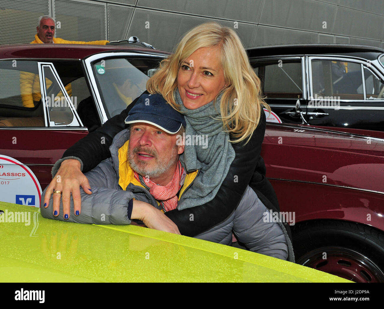 Munich, Germany. 28th Apr, 2017. Actor Axel Milbert and wife Judith at the Arabella Classics Route 2017 in Munich, Germany, 28 April 2017. Money raised by the classic car rally will be donated to the victims of recent flooding in Simbach. Photo: Ursula Düren/dpa/Alamy Live News Stock Photo