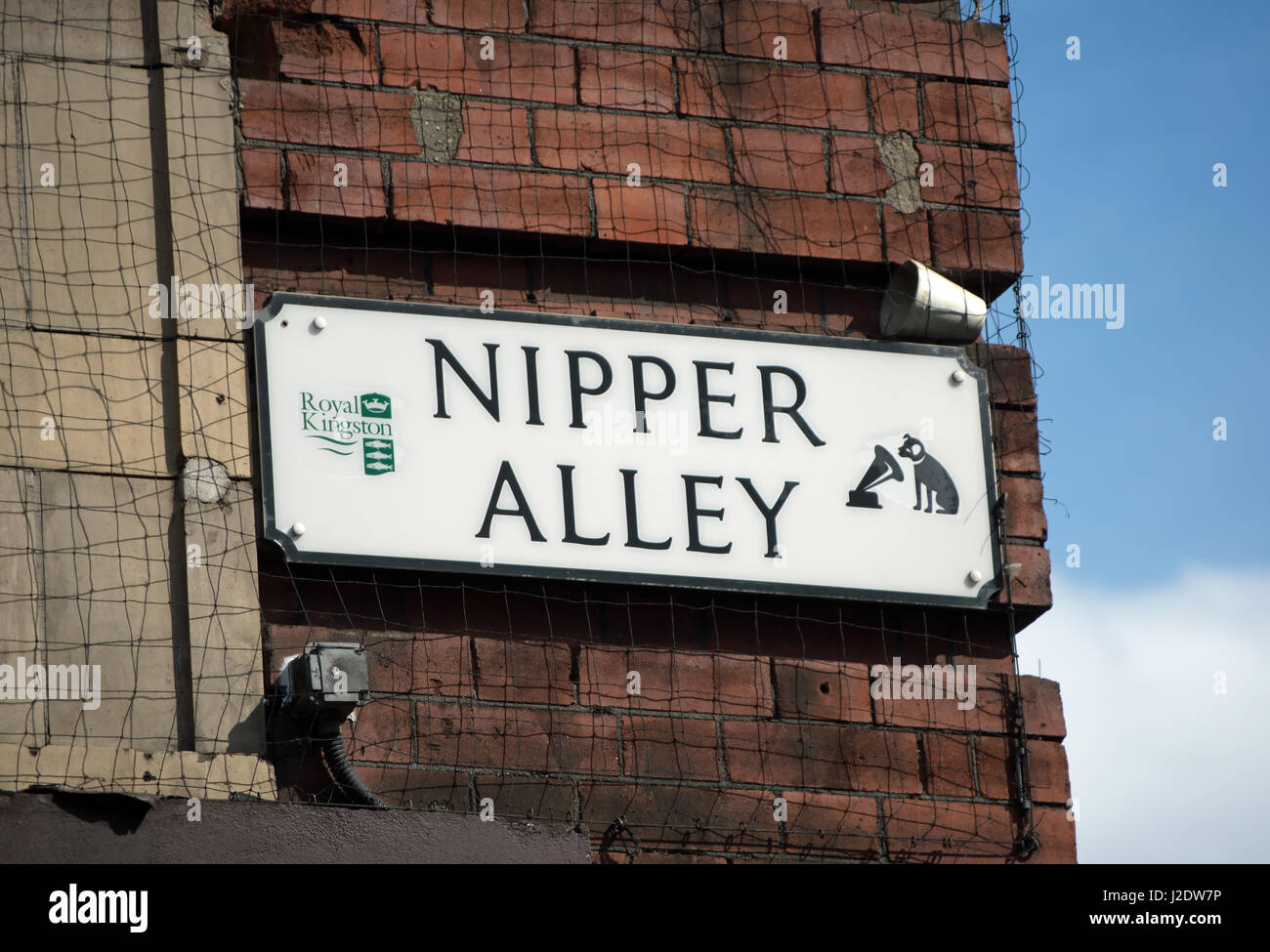 street name sign for nipper alley, named for the dog used in the logo of his masters voice, or hmv, record company, kingston, surrey, england Stock Photo